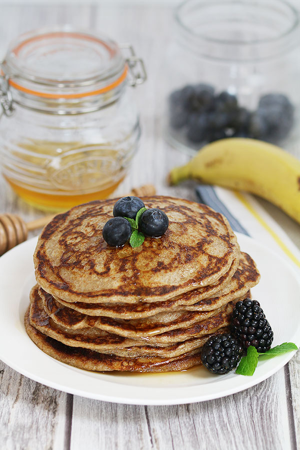 rye sourdough pancakes with maple syrup and blue berries