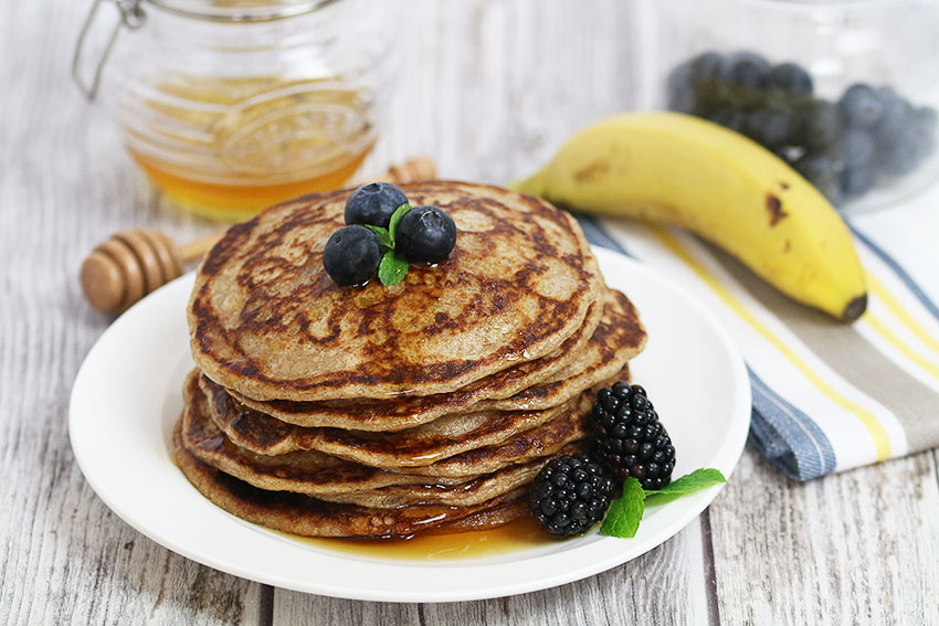 rye sourdough pancakes with maple syrup and blue berries