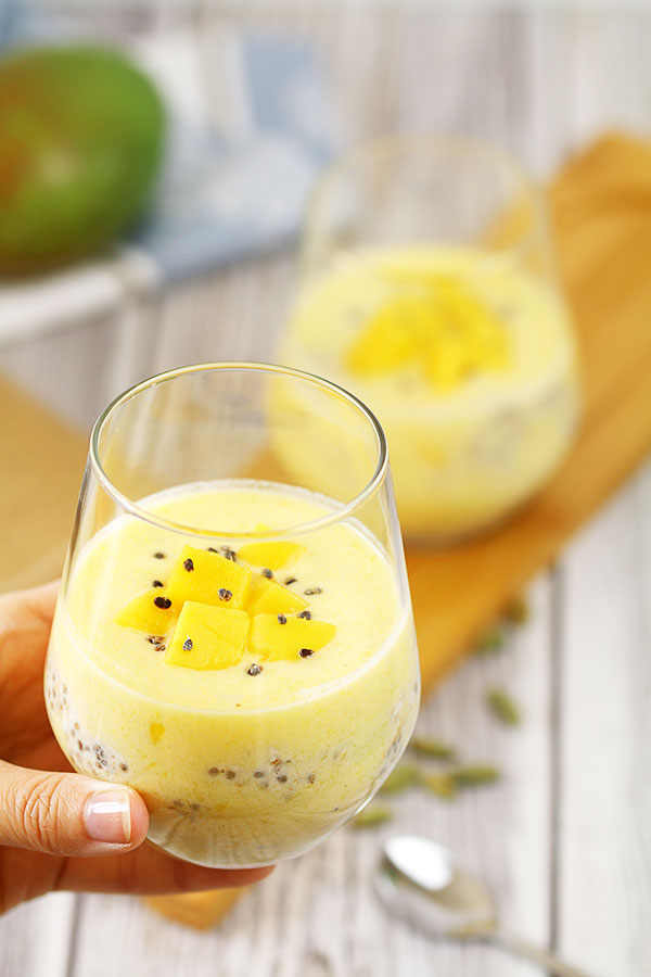 Mango Lassi Overnight Oats Glass In Hand