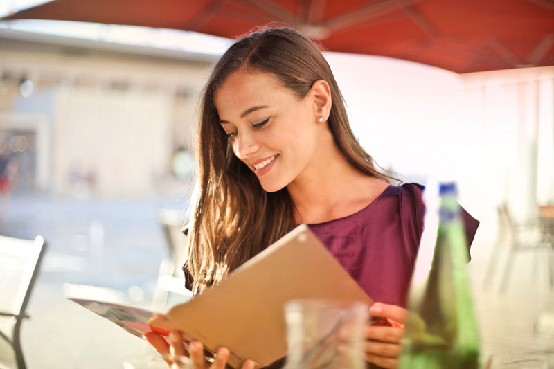 woman reading gluten-free menu